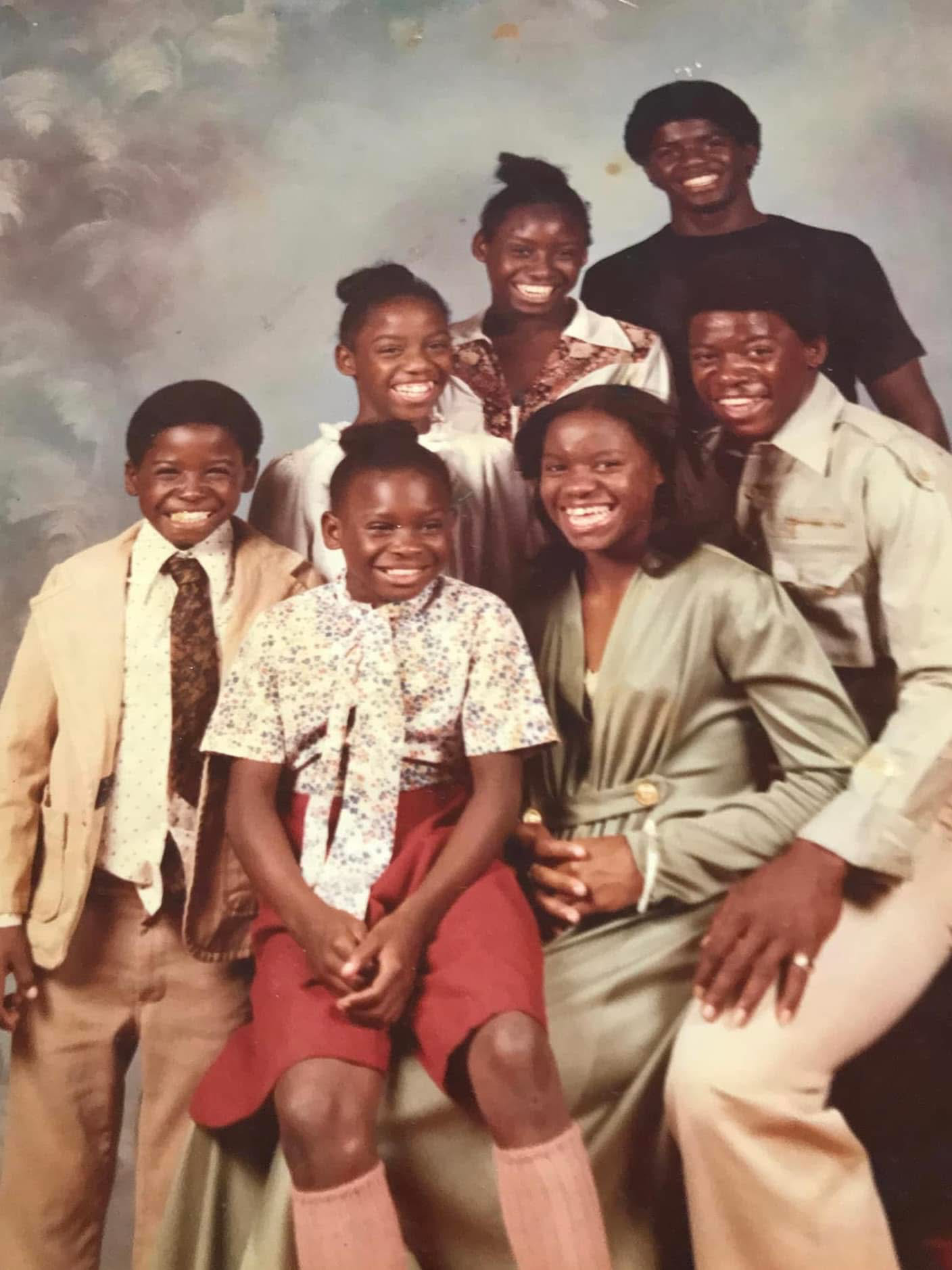 A vintage studio portrait of Auguree with her siblings